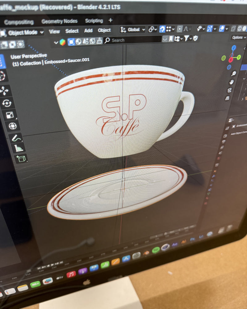 3D model of a coffee cup with 'S.P. Caffè' branding on a computer screen.
